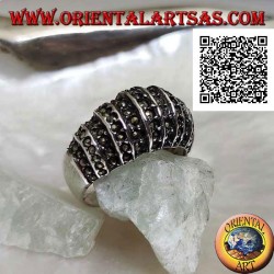 Silver ring with a rounded band on the front cut by vertical lines and studded with marcasite