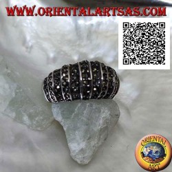 Silver ring with a rounded band on the front cut by vertical lines and studded with marcasite