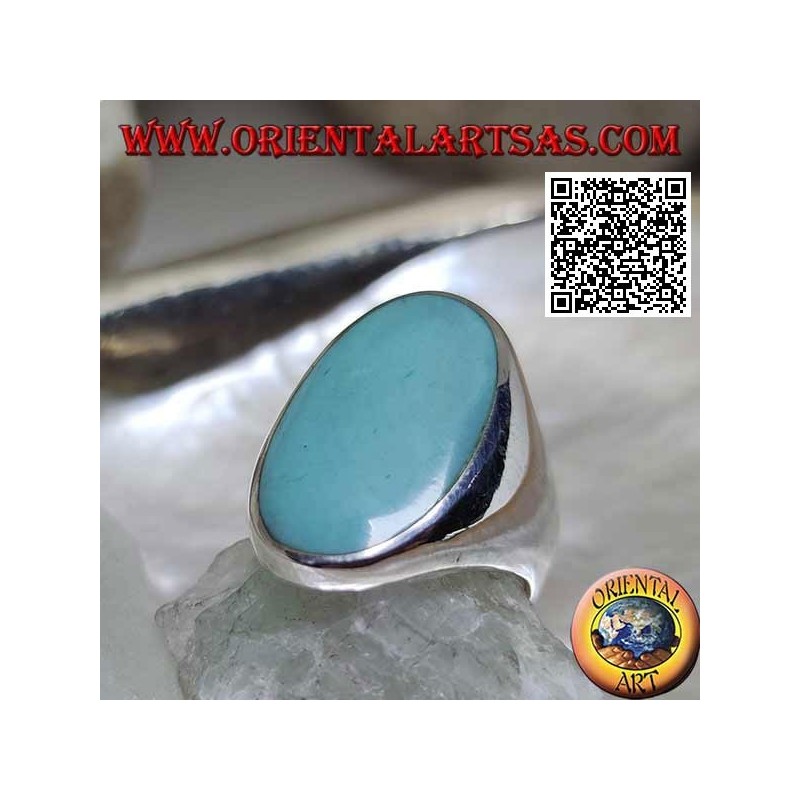 Silver ring with oval turquoise set flush with the edge on a smooth frame