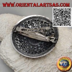 Silver chiseled shield with floral decoration with central flower (metal clip closure)