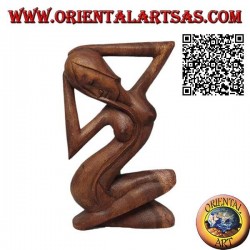 Sculpture of a sensual naked woman with crossed legs and long hair, in 21 cm suar wood