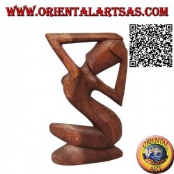 Sculpture of a sensual naked woman with crossed legs and long hair, in 21 cm suar wood