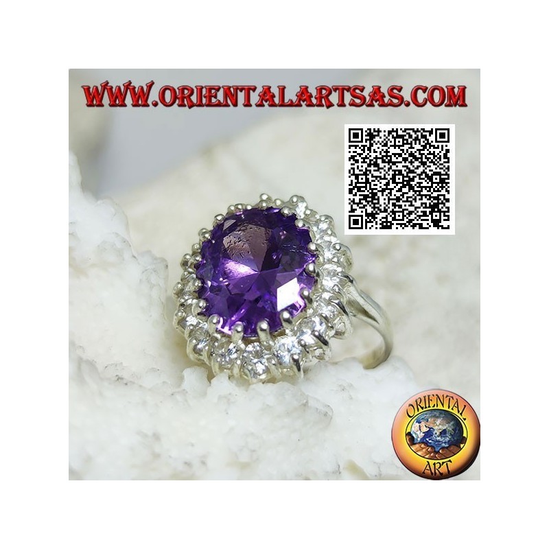 Silver ring with faceted oval synthetic amethyst set surrounded by white zircons