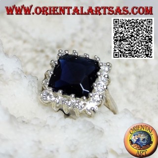Silver ring with faceted square synthetic sapphire set surrounded by white zircons