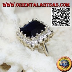 Silver ring with faceted square synthetic sapphire set surrounded by white zircons