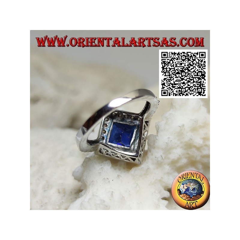 Silver ring with square rhomboid faceted synthetic sapphire surrounded by white zircons