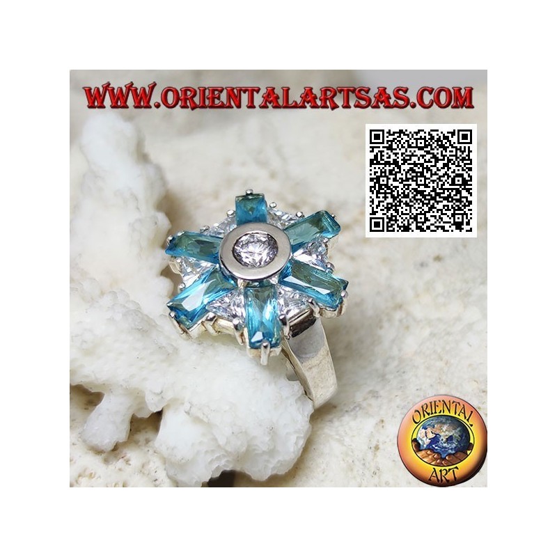 Anillo de plata con seis pétalos de topacio azul y circonitas blancas centrales alternas