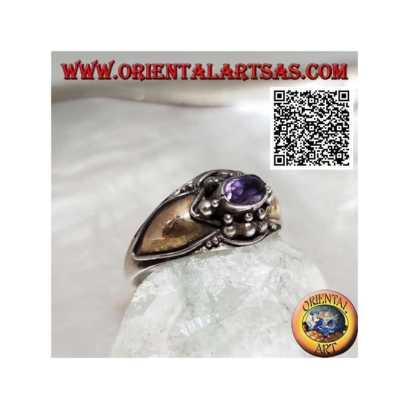 Silver ring with horizontal oval amethyst with balls above and below and 14 karat gold plates on the sides