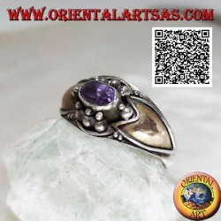 Silver ring with horizontal oval amethyst with balls above and below and 14 karat gold plates on the sides