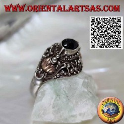Silver ring with a raised horizontal oval onyx on ethnic setting with 14 carat gold leaves