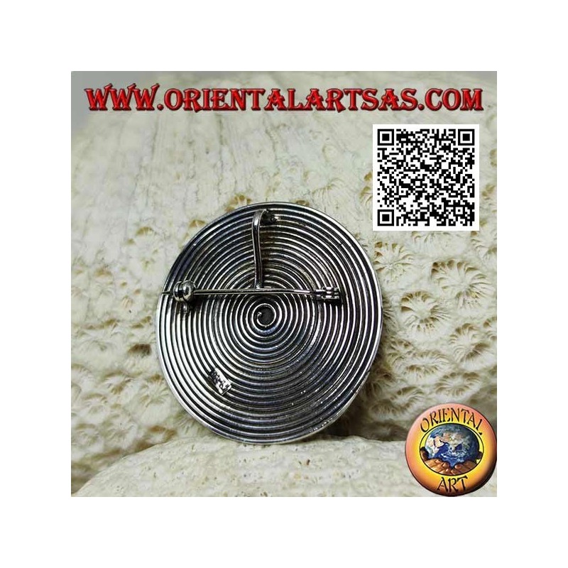 Round spiral silver brooch with central ball