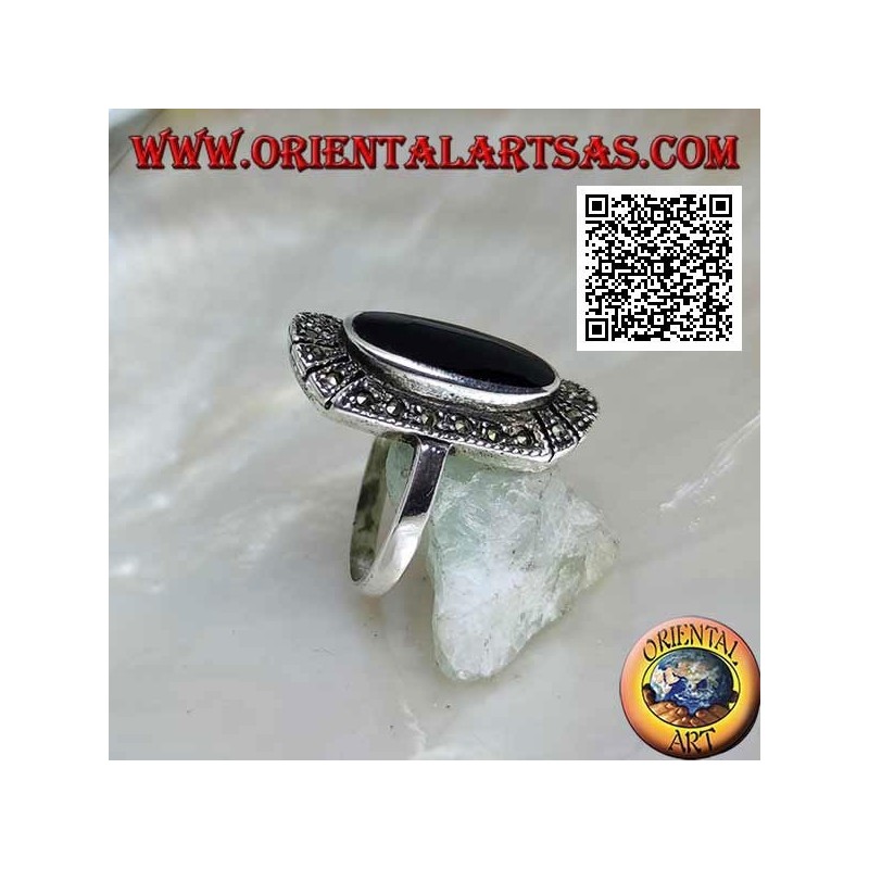Silver ring with raised elongated oval onyx surrounded by marcasite