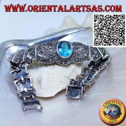 Silberne Gliederarmbänder mit großem zentralen facettierten ovalen blauen Topas, besetzt mit Markasit