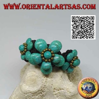 Soft bracelet with five turquoise paste flowers and golden brass balls