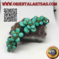 Soft bracelet with five turquoise paste flowers and golden brass balls