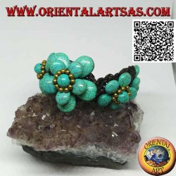 Soft bracelet with five turquoise paste flowers and golden brass balls