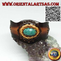 Adjustable rigid bracelet with central oval turquoise and two-color leather processing