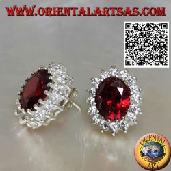 Silver lobe earrings with oval faceted garnet surrounded by white zircons