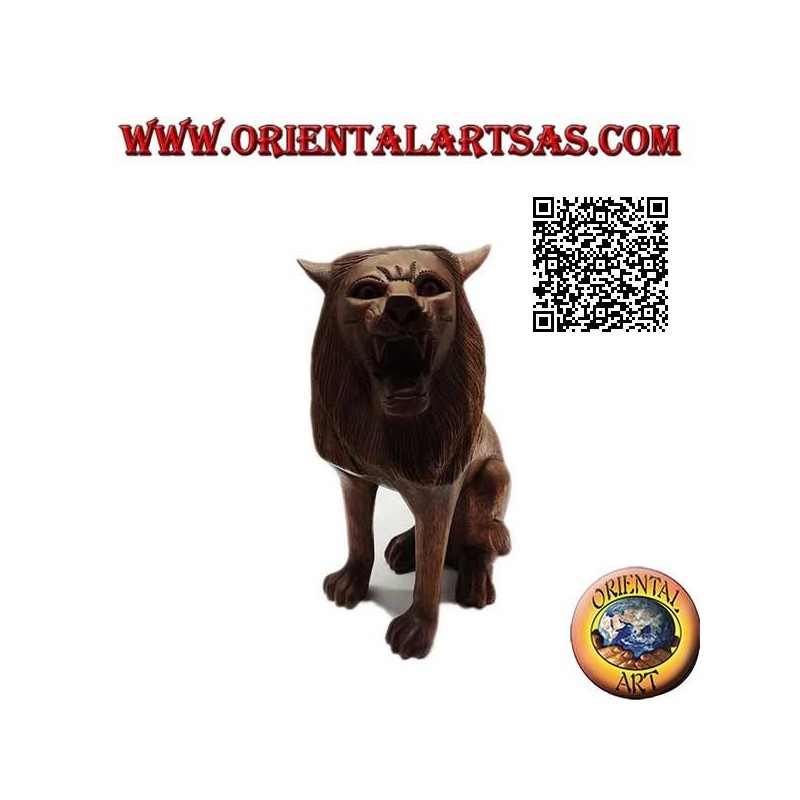 Sculpture of a seated lion hand carved from a single 25 cm block of suar wood