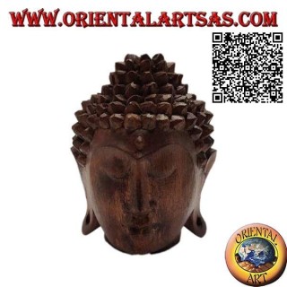 Three-dimensional Buddha head sculpture carved from a single 12 cm block of suar wood