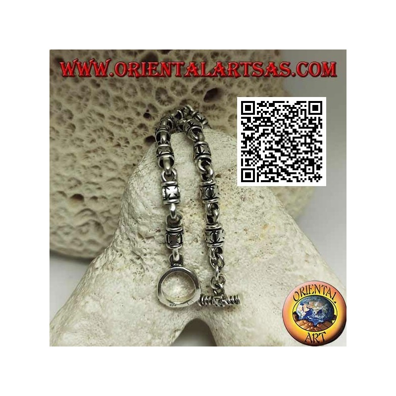 Soft silver cylinder bracelet with embossed maltese crosses alternating with rings and T-shaped clasp