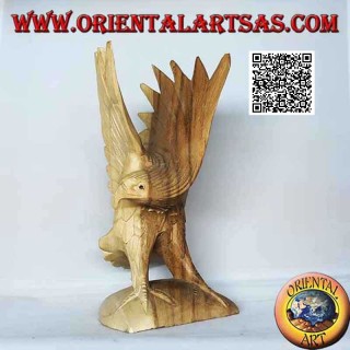Sculpture of the golden eagle with spread wings standing in suar wood of 23 cm