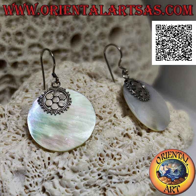 Silver earrings with flat round mother-of-pearl pendant attached to a six-petal flower