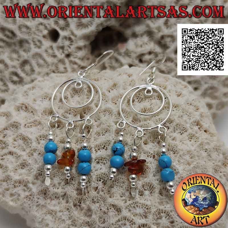 Concentric circles silver earrings with pendants of turquoise and silver beads and amber fragments