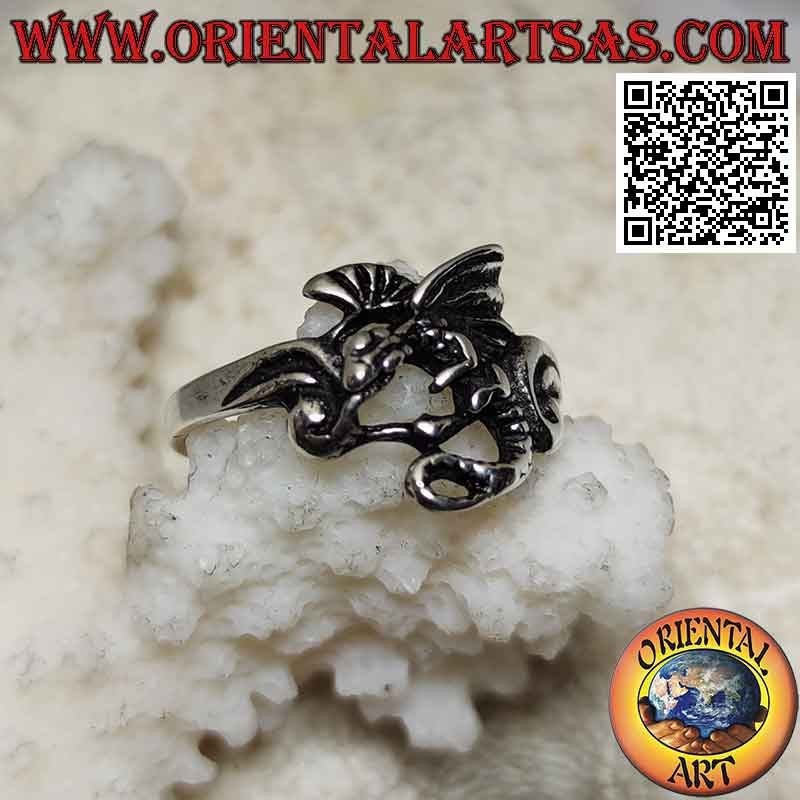 Silver ring with basilisk dragon in profile flight