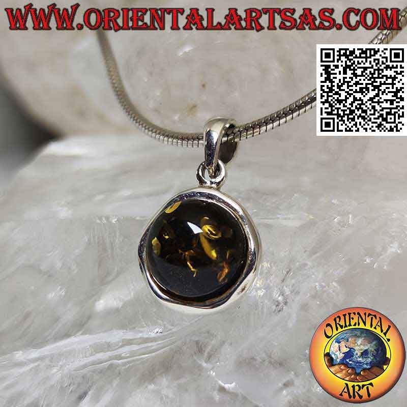 Silver pendant with cabochon round green amber on an irregular round setting