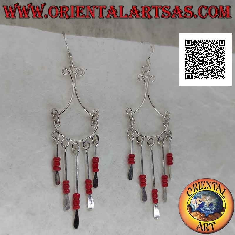 Silver earrings with a bow hooked by convex threads and rows of trio of coral beads