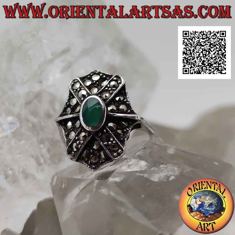 Silver ring with oval green agate on octagonal shield and superimposed cross studded with marcasite