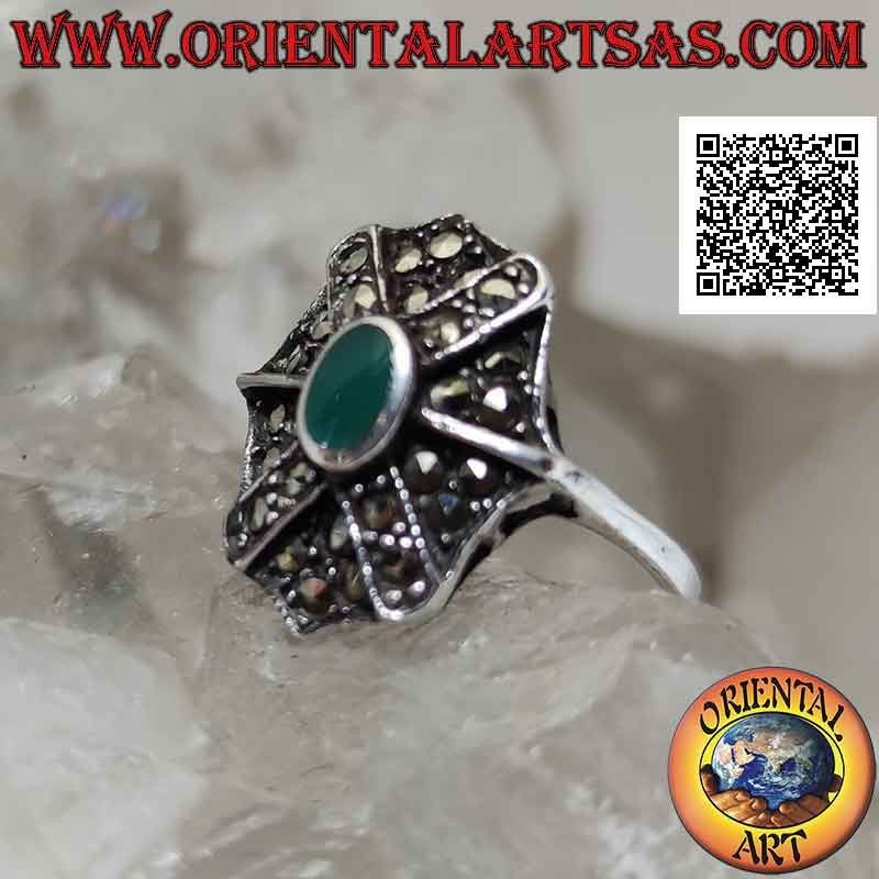 Silver ring with oval green agate on octagonal shield and superimposed cross studded with marcasite