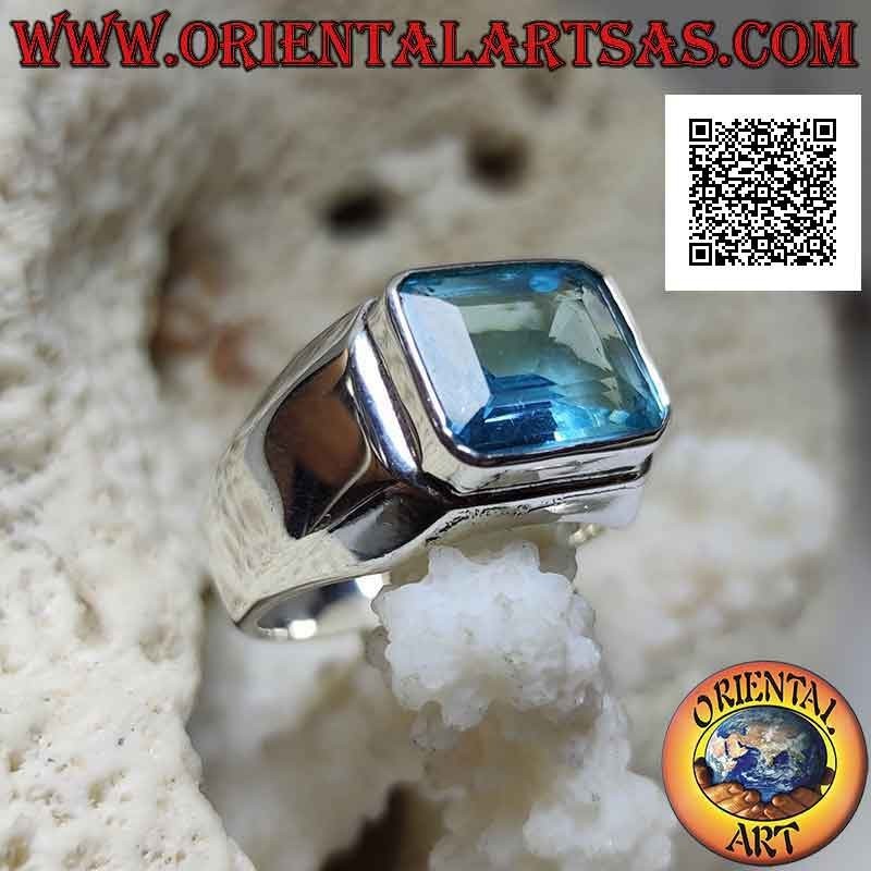 Smooth silver ring with a raised baguette-cut rectangular topaz
