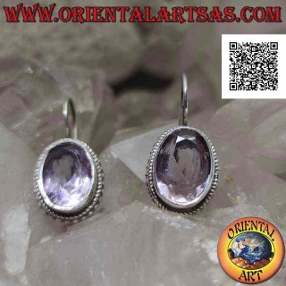 Silver earrings with natural oval faceted clear amethyst surrounded by weaving