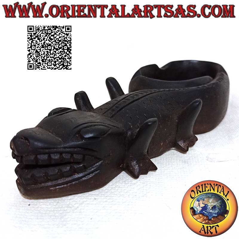 Ashtray in the shape of a reptile (Komodo dragon) in dark mahogany wood (cup on the left)