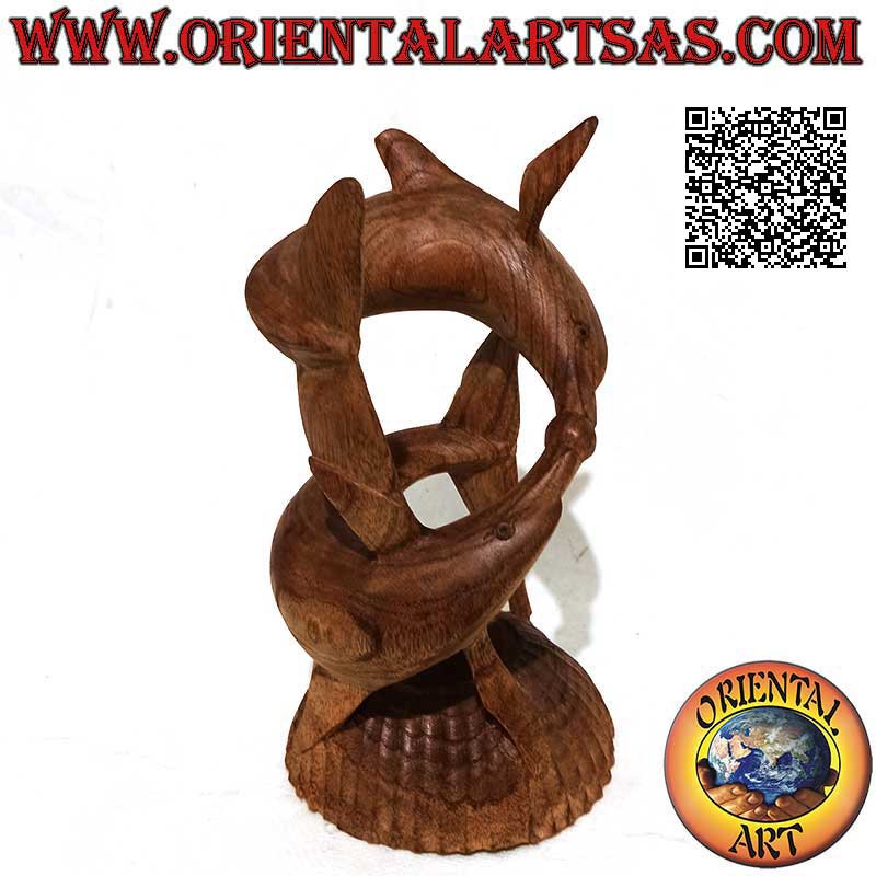Sculpture of a pair of dolphins in a helical game with a ball between the snouts in 22 cm American pine wood