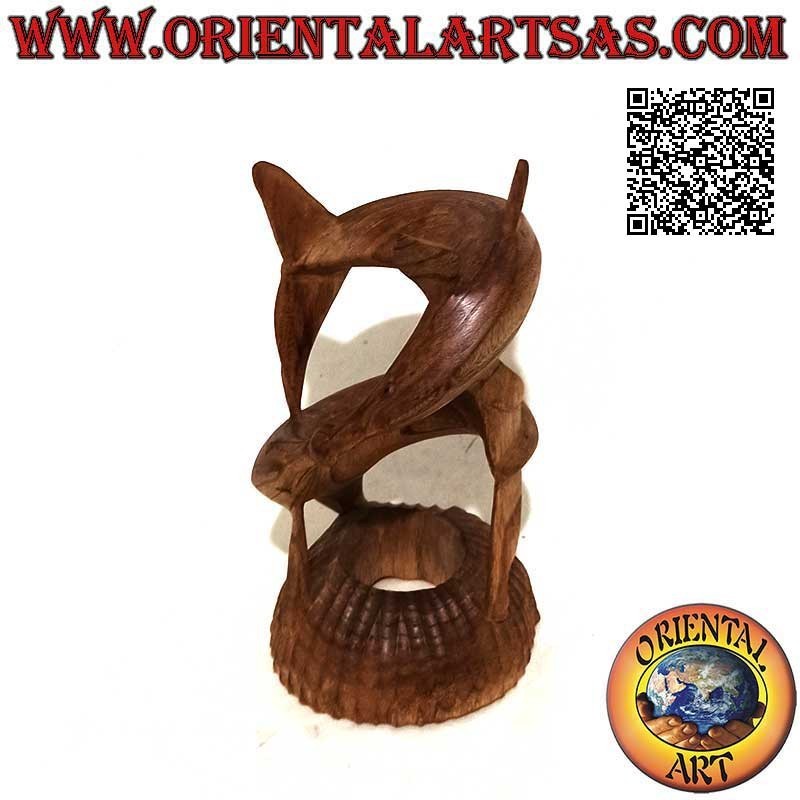 Sculpture of a pair of dolphins in a helical game with a ball between the snouts in 22 cm American pine wood
