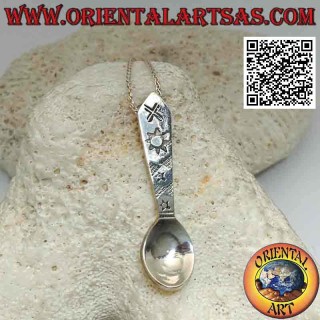 Silver pendant in the shape of a spoon with engraved astral symbols