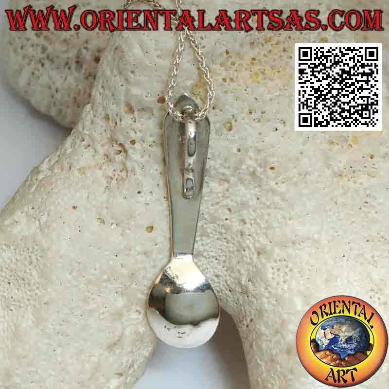Silver pendant in the shape of a spoon with engraved astral symbols