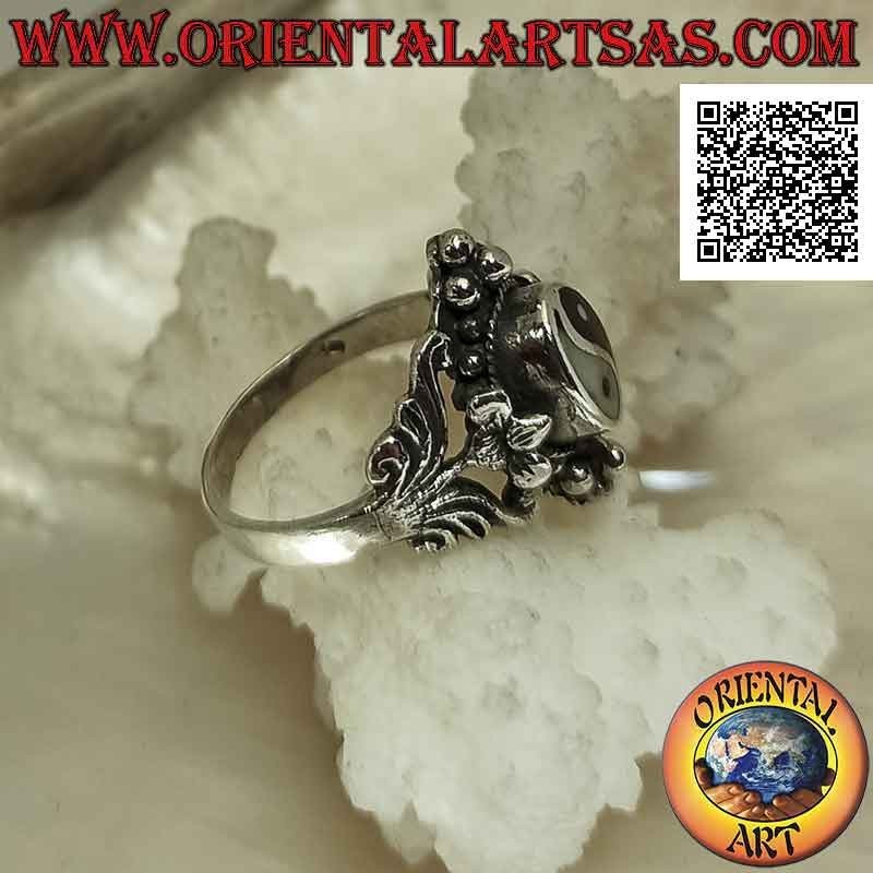 Silver ring with yin yang of onyx and mother of pearl on ethnic setting with floral decorations and balls