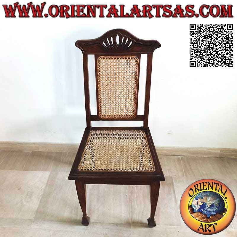 Silla de estilo colonial con flor de loto, en madera de teca y asiento y respaldo de paja de Viena