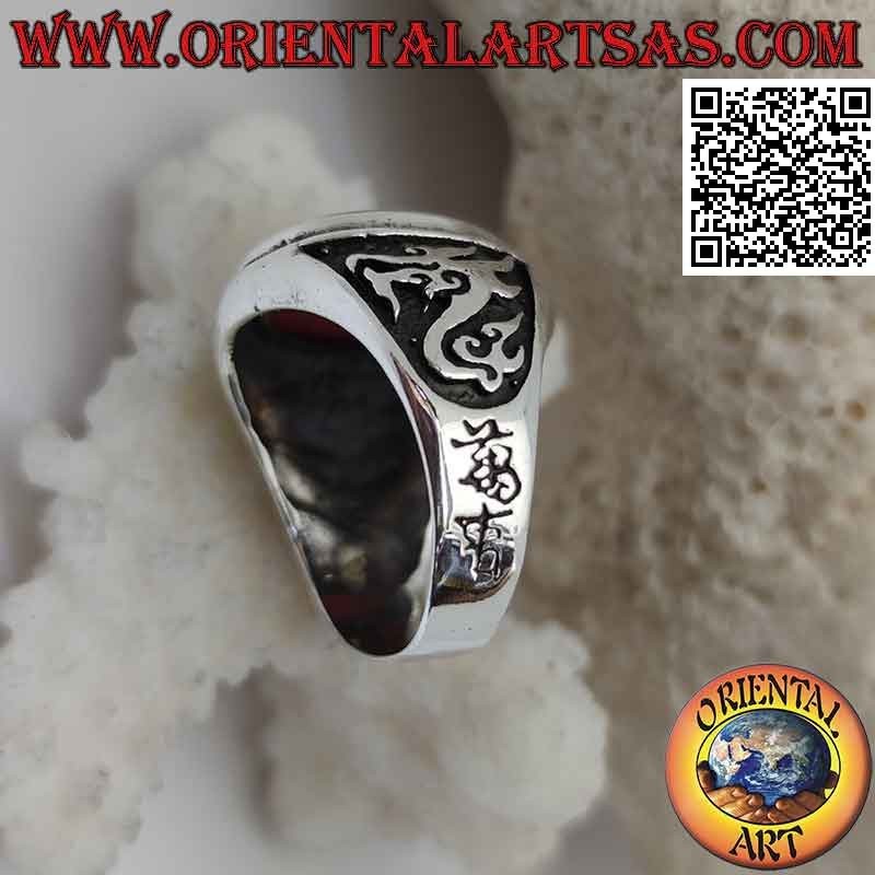Silver ring with oval carnelian and dragon in high relief on the sides