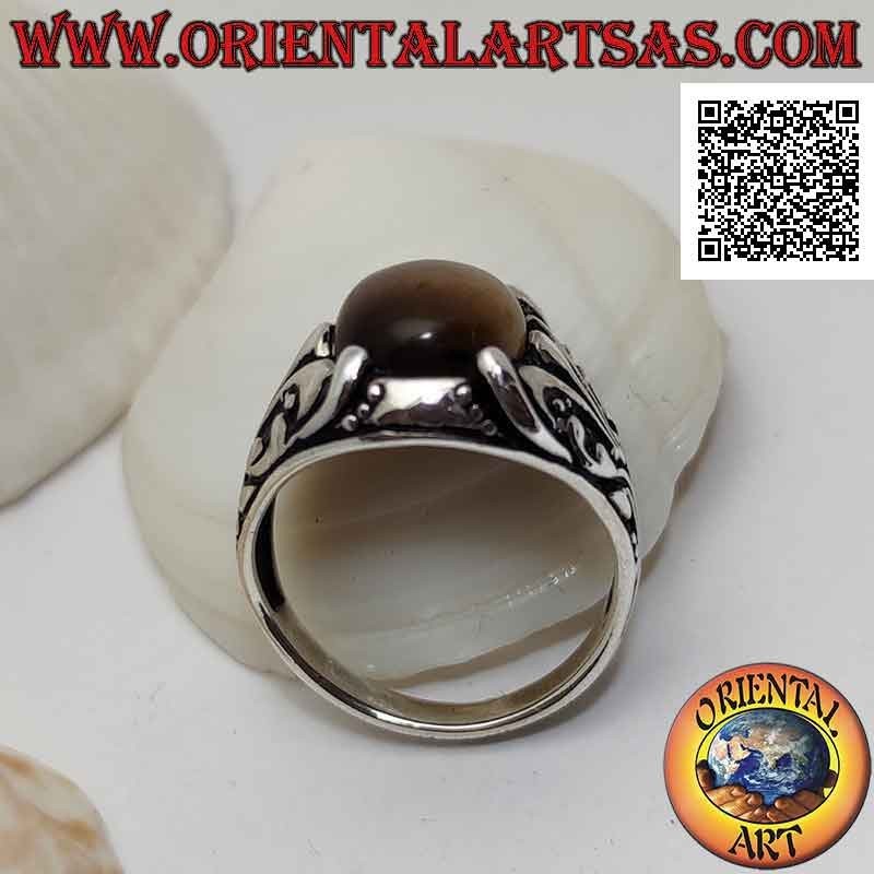 Silver ring with cabochon oval tiger eye set with floral decoration with lily on the sides