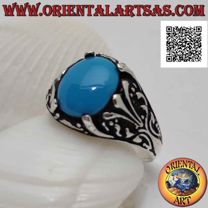 Anello in argento con turchese ovale cabochon incastonato da decorazione floreale con giglio sui lati
