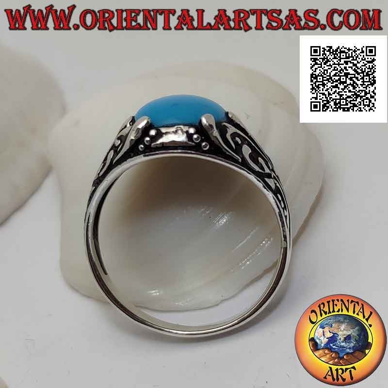 Silver ring with oval cabochon turquoise set with floral decoration with lily on the sides