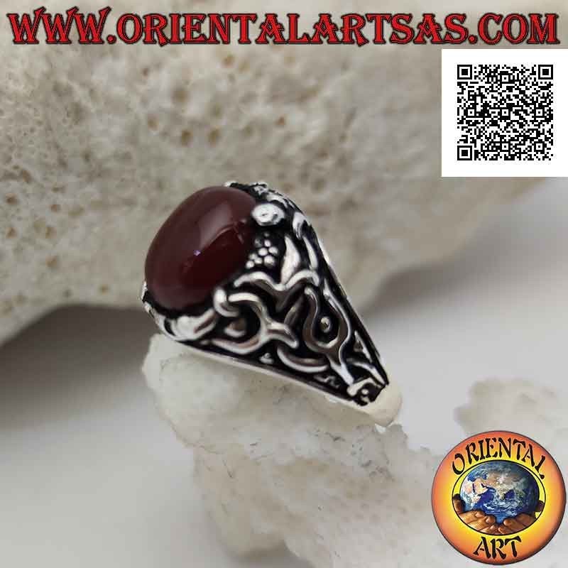 Silver ring with oval cabochon carnelian set with floral decoration on the sides