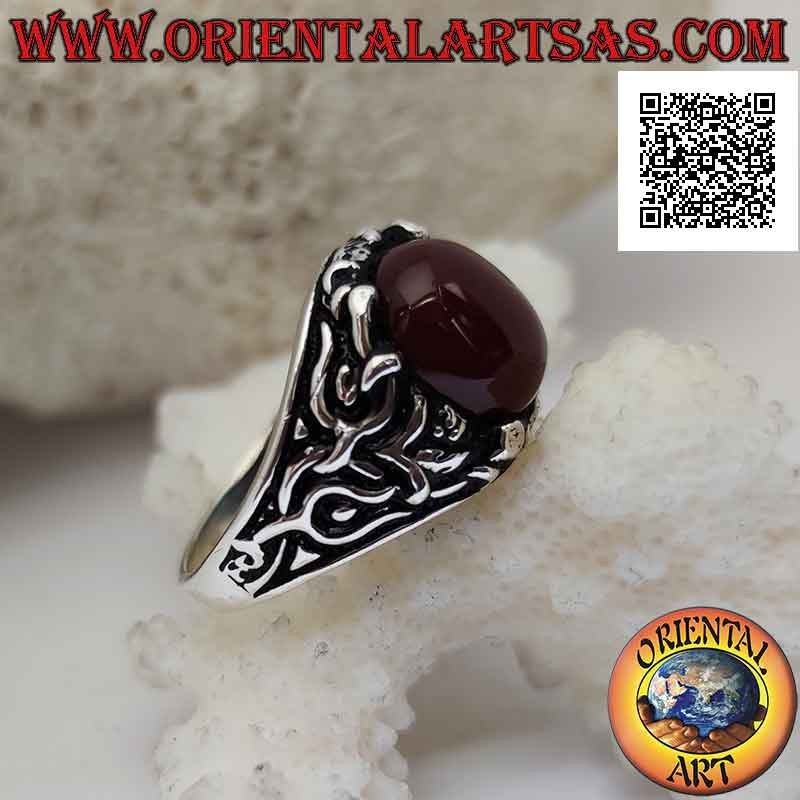 Silver ring with oval cabochon carnelian set with floral decoration on the sides
