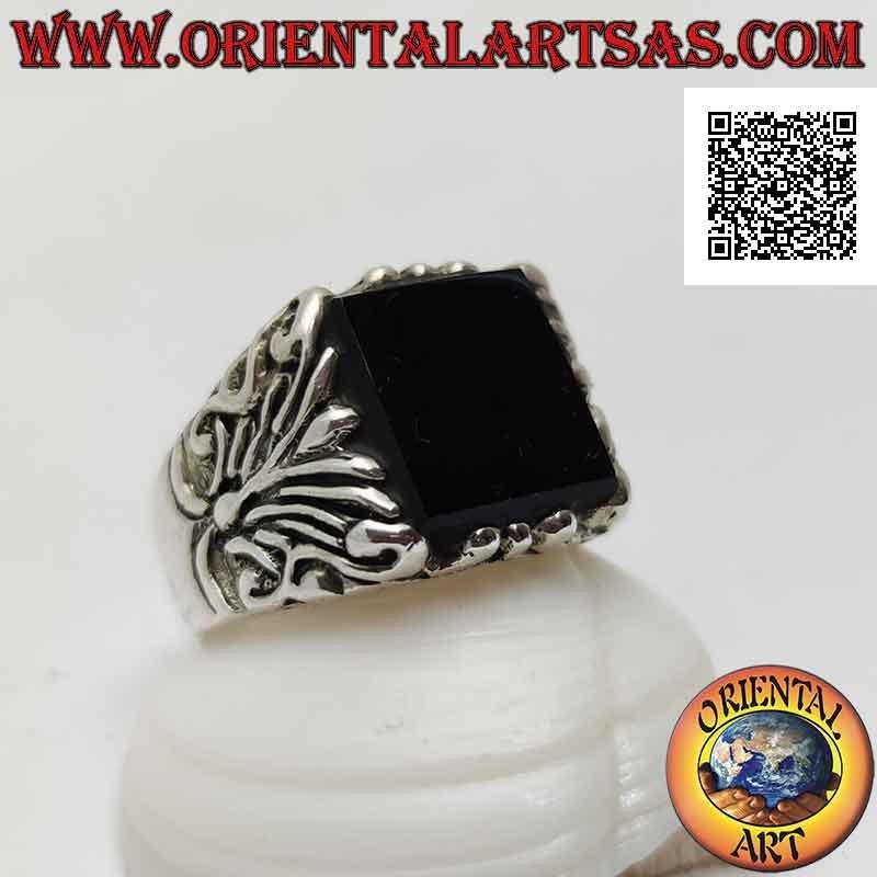 Solid silver ring with flat protruding square onyx and floral decorations engraved on the sides