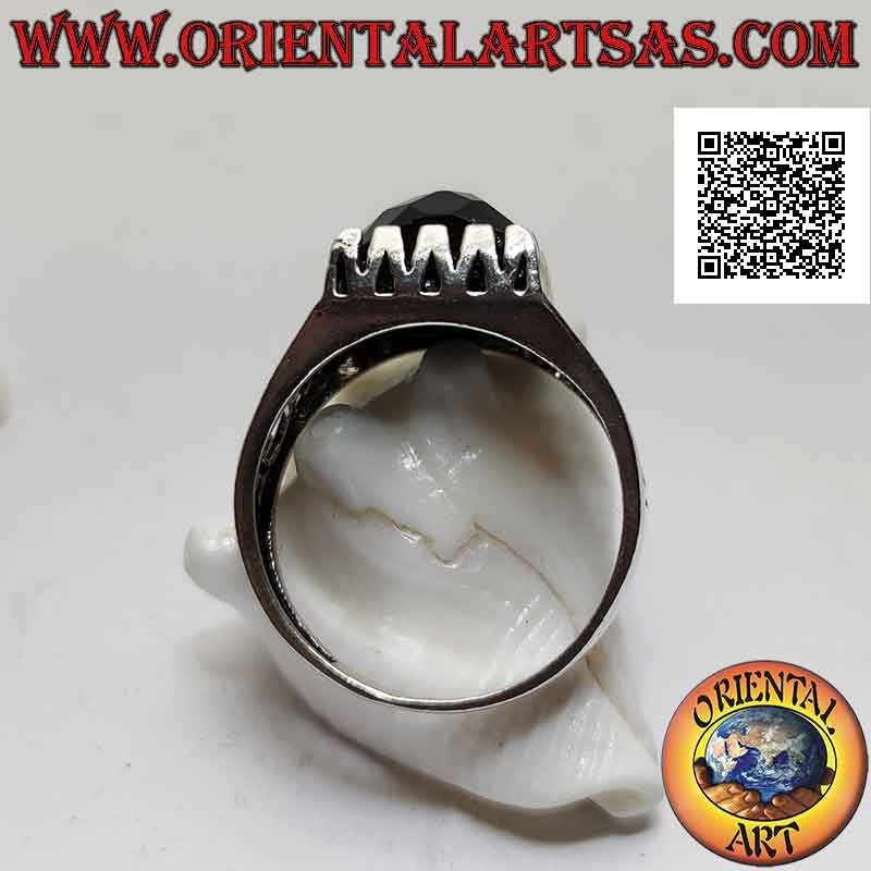 Silver ring with faceted spinel set in a square surrounded by openwork decoration